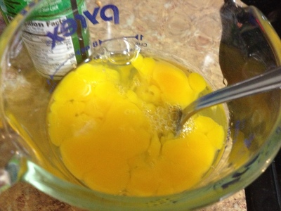 2.  Crack eggs and gently break up the yolks with a fork (no vigorous beating, folks).